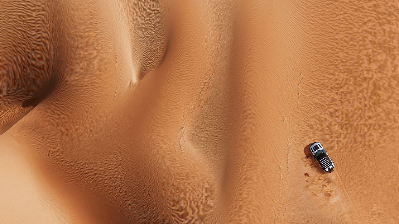 Top View of Car Drifting Over Sand Dust Road